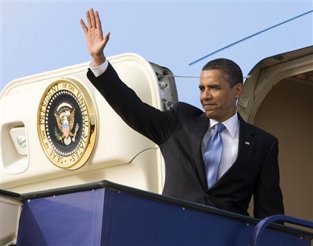 U.S. President Barack Obama waves before leaving for Cairo at King Khalid International Airport in Riyadh